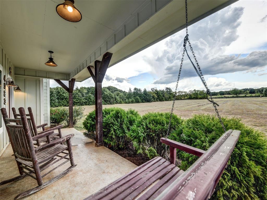 4983 Applegate Road Bowie, TX 76230 - Photo 2 of 40 a view of a chairs and table in patio with a backyard