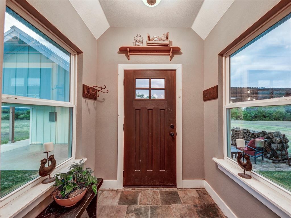 4983 Applegate Road Bowie, TX 76230 - Photo 27 of 40 a front view of a house with entryway