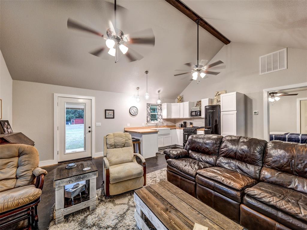 4983 Applegate Road Bowie, TX 76230 - Photo 31 of 40 a living room with furniture and a large window