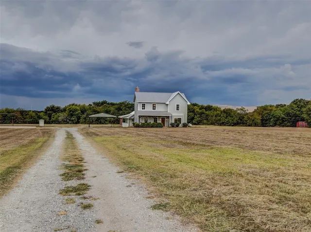a front view of a house with a lake view