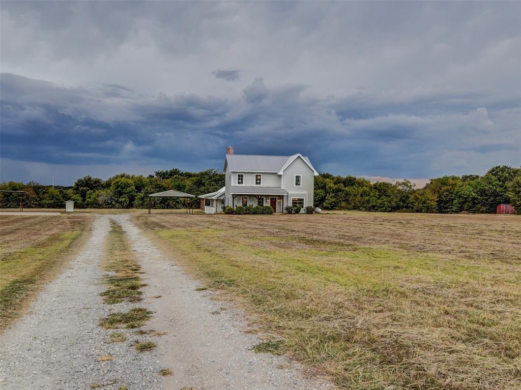 4983 Applegate Road Bowie, TX 76230 - Photo 7 of 40 a front view of a house with a lake view