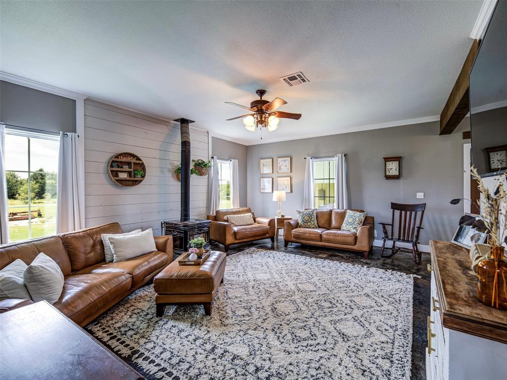 4983 Applegate Road Bowie, TX 76230 - Photo 9 of 40 a living room with furniture and a couch