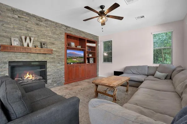 a living room with furniture and a window