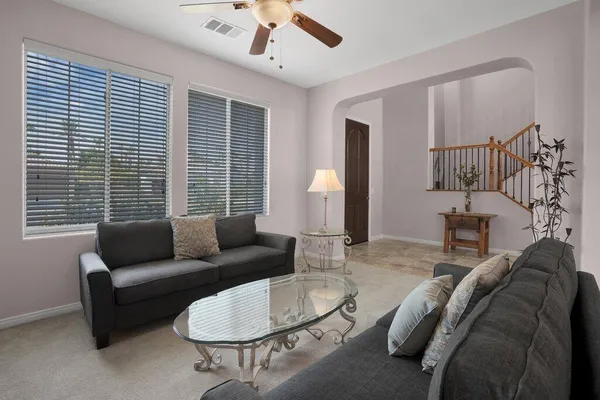 a living room with furniture and a walk in closet
