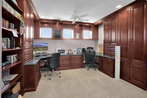 a view of a house with pool and chairs