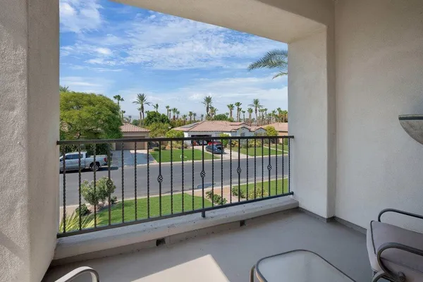 a swimming pool with outdoor seating and yard