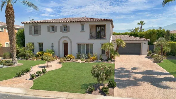 a kitchen with granite countertop cabinets stainless steel appliances and a counter space