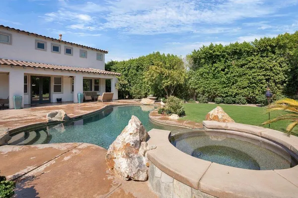 a backyard of a house with lots of green space