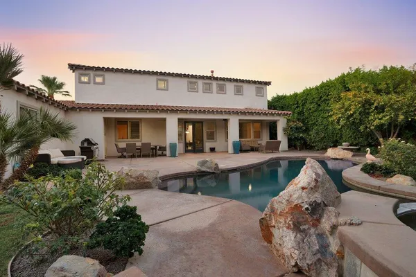 a view of yard with grass and trees