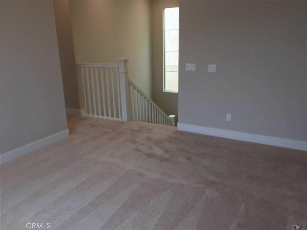 171 Interval Irvine, CA 92618 - Photo 7 of 8 a view of an empty room with windows