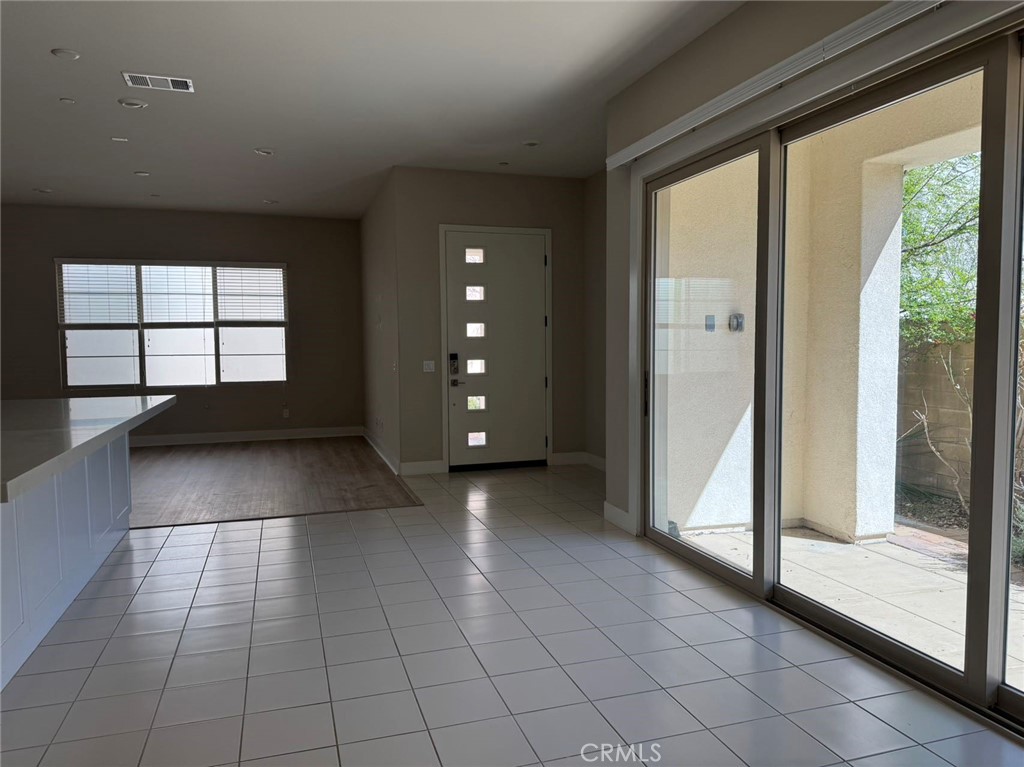 171 Interval Irvine, CA 92618 - Photo 9 of 19 a view of a hallway with an empty room and window