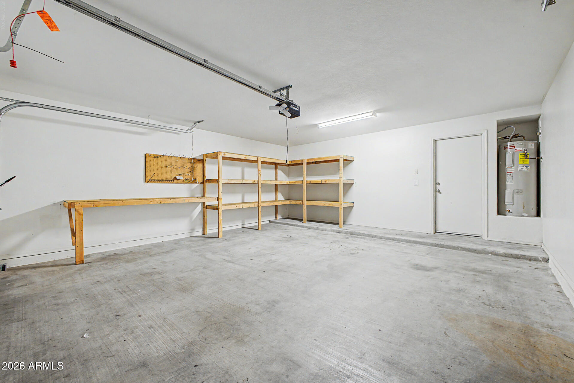 8337 West Payson Road Tolleson, AZ 85353 - Photo 22 of 44 Garage shelves