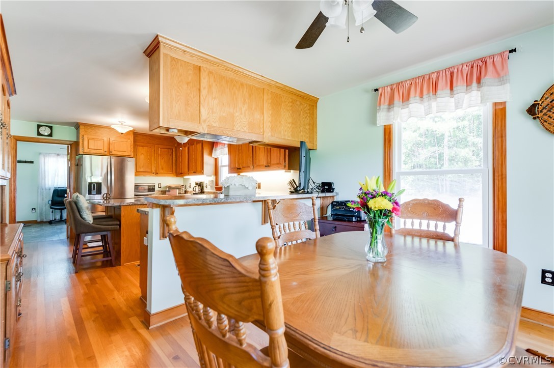 19070 Halifax Road Carson, VA 23830 - Photo 11 of 43 a dining room with furniture and a large window
