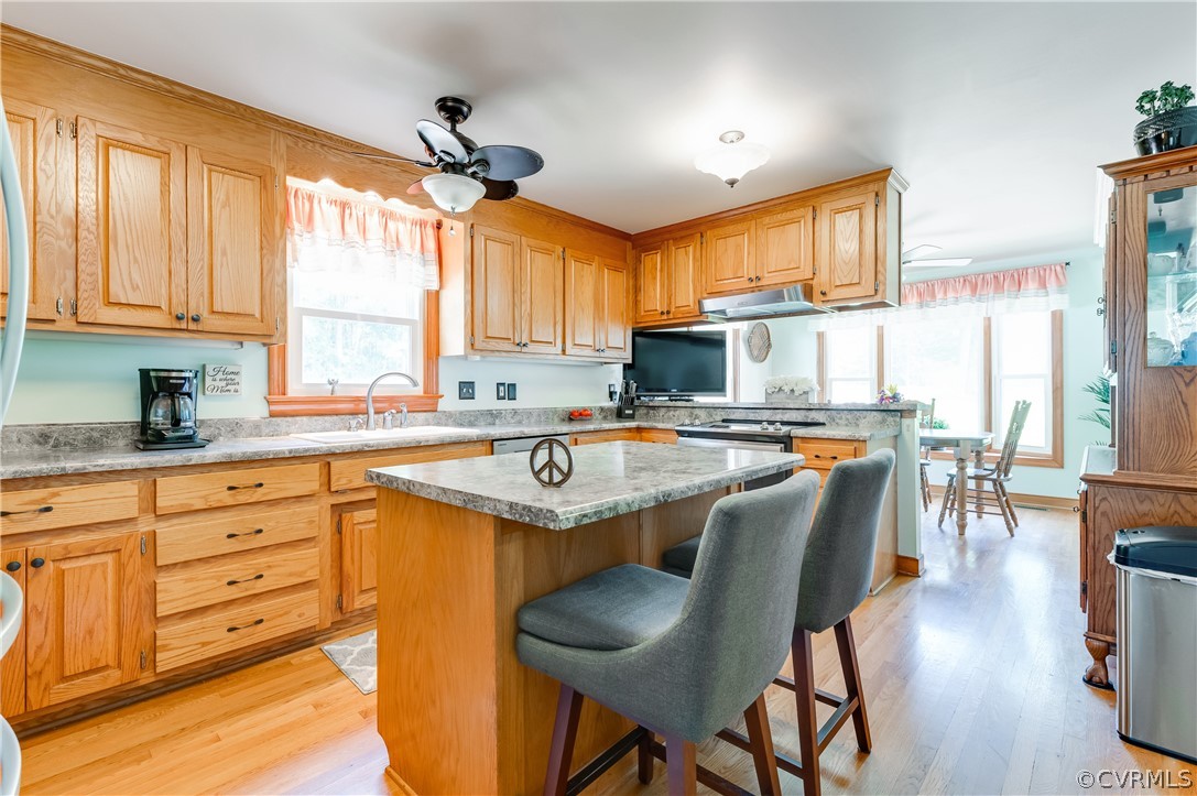 19070 Halifax Road Carson, VA 23830 - Photo 14 of 43 a kitchen with sink cabinets and dining table