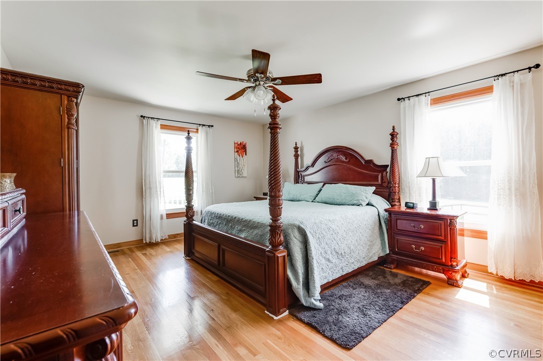 19070 Halifax Road Carson, VA 23830 - Photo 18 of 43 a bedroom with a bed and wooden floor
