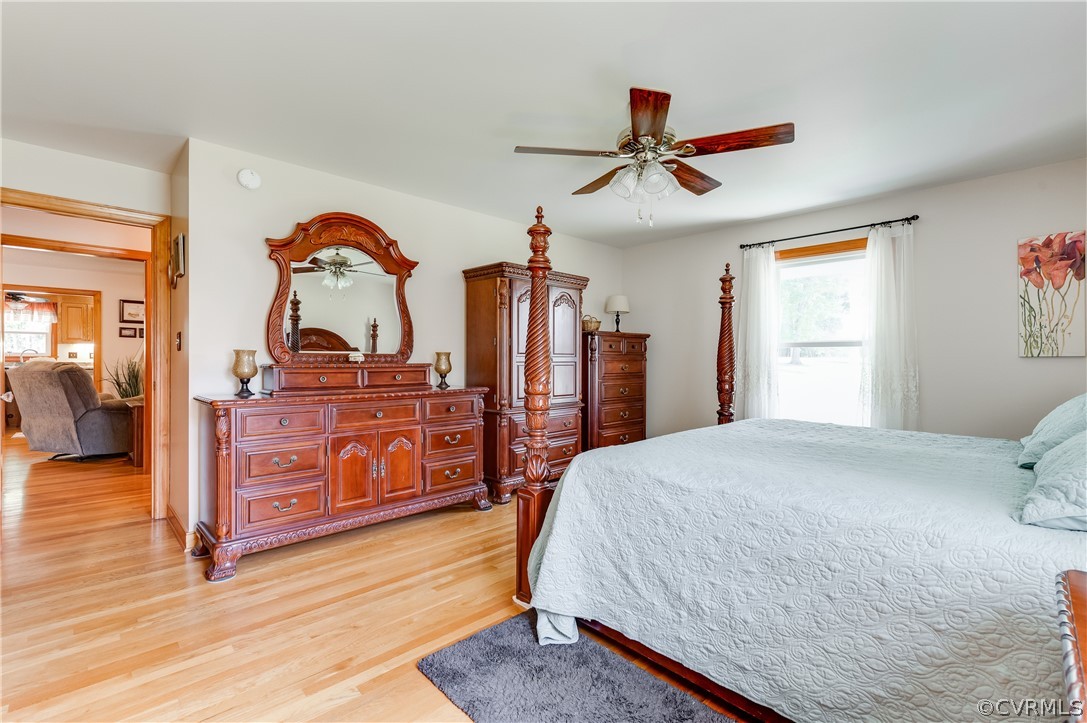 19070 Halifax Road Carson, VA 23830 - Photo 19 of 43 a bedroom with a bed and wooden floor