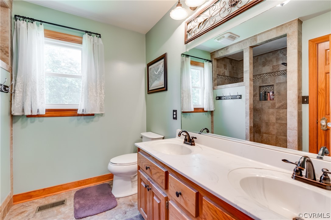19070 Halifax Road Carson, VA 23830 - Photo 20 of 43 a bathroom with a sink and a mirror