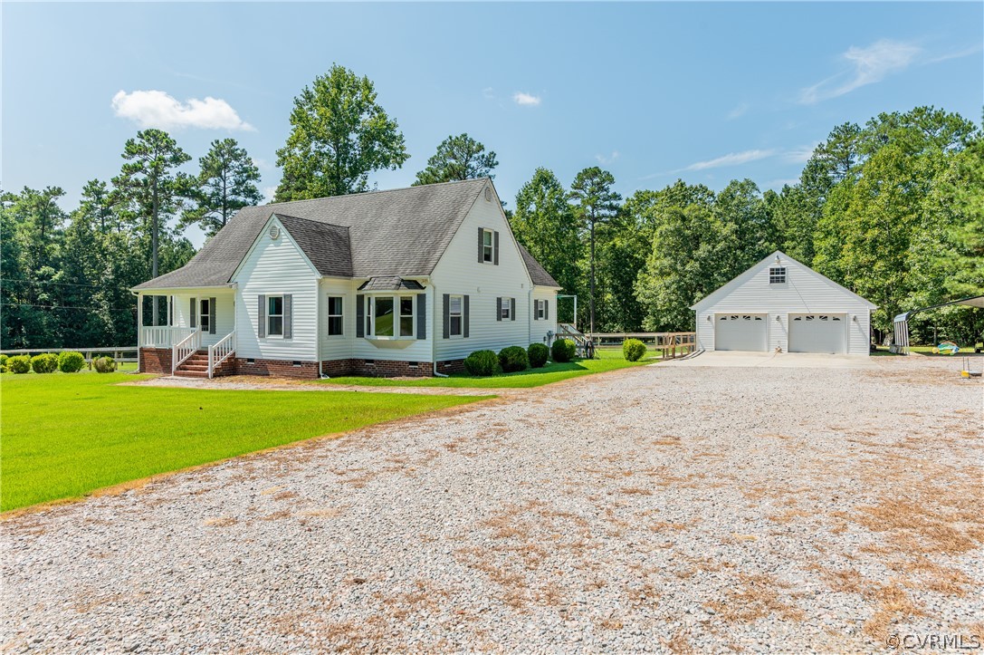 19070 Halifax Road Carson, VA 23830 - Photo 2 of 43 a view of house with garden and tall trees
