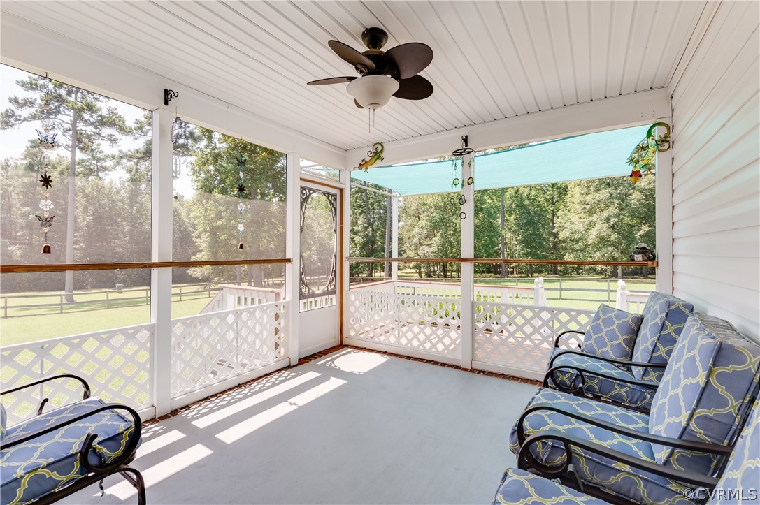 19070 Halifax Road Carson, VA 23830 - Photo 30 of 43 a living room with furniture and a floor to ceiling window