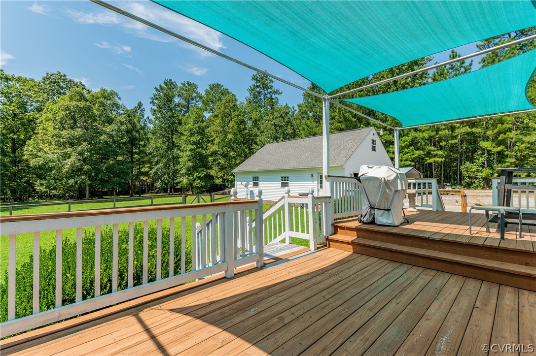 19070 Halifax Road Carson, VA 23830 - Photo 32 of 43 a view of balcony with wooden floor and outdoor seating