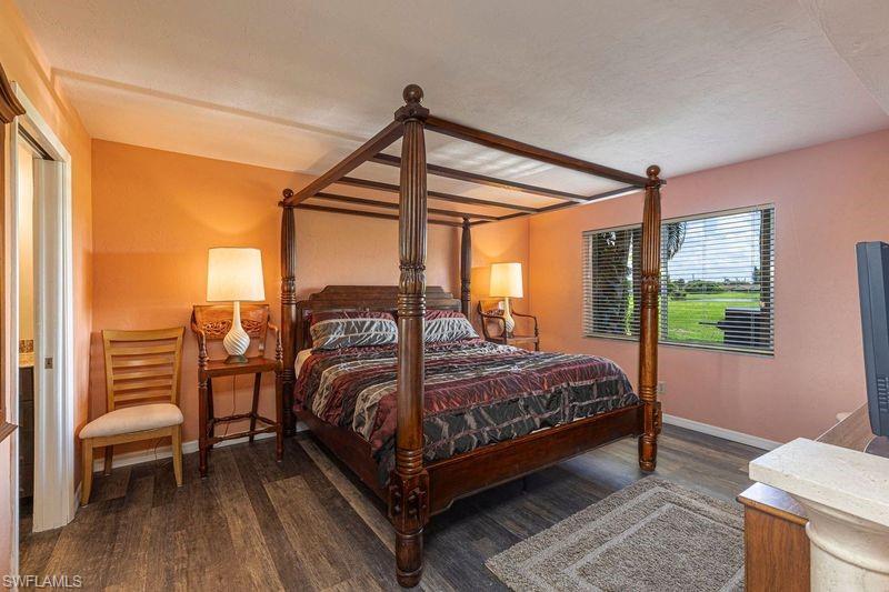 3832 Snowflake Lane, Unit 1207 Naples, FL 34112 - Photo 13 of 22 a bedroom with a bed and a window