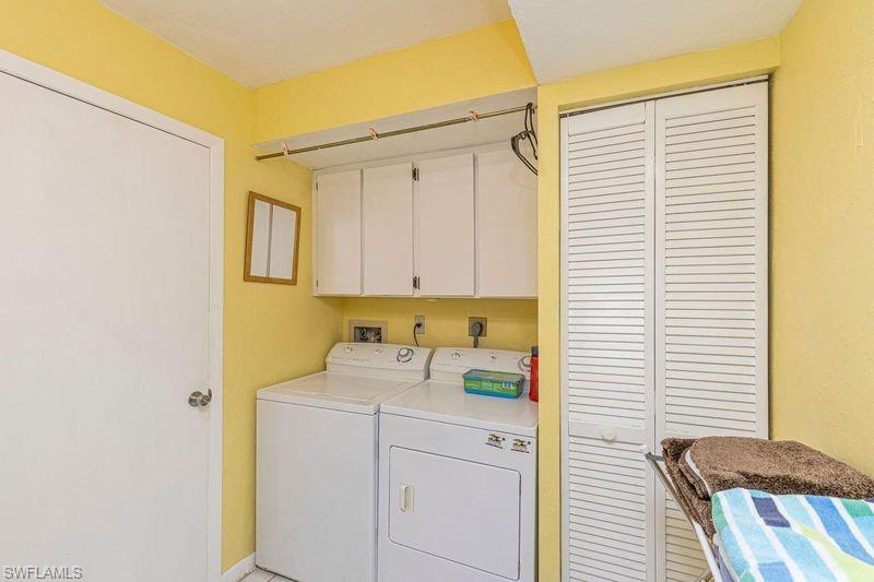 3832 Snowflake Lane, Unit 1207 Naples, FL 34112 - Photo 17 of 22 a view of storage and utility room with washer and dryer