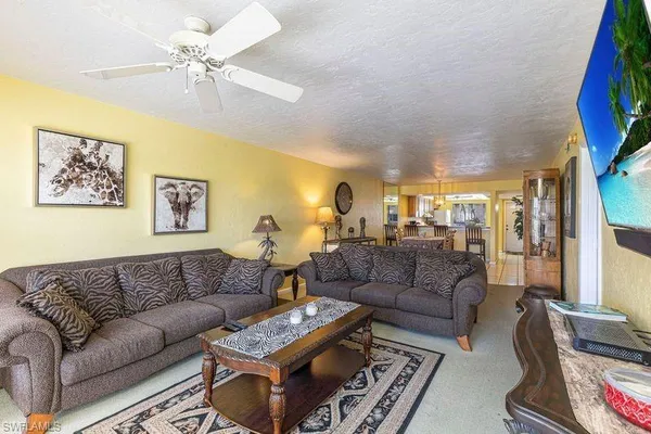 a living room with furniture and a table