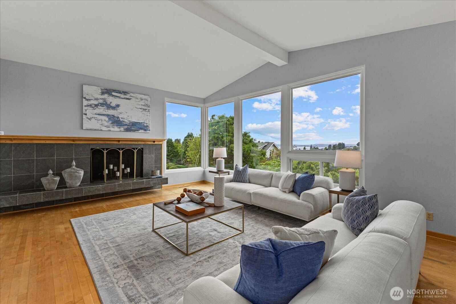 2819 West McGraw Street Seattle, WA 98199 - Photo 16 of 40 a living room with furniture and a fireplace