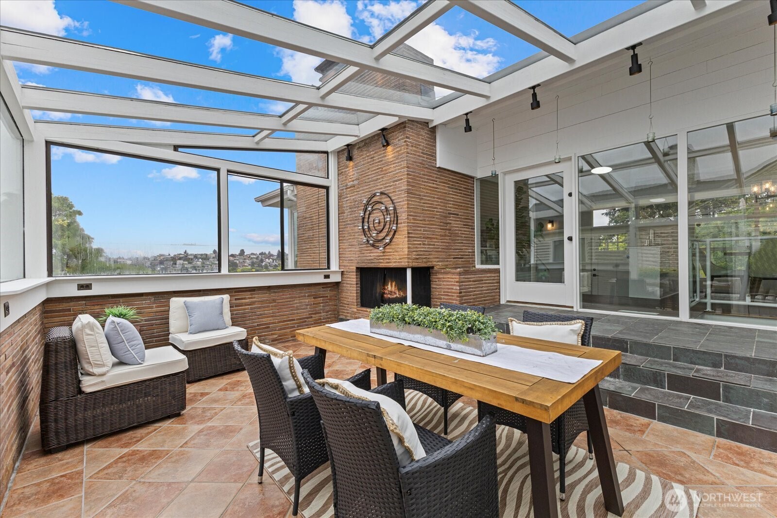 2819 West McGraw Street Seattle, WA 98199 - Photo 19 of 40 a dining room with furniture a rug and a large window