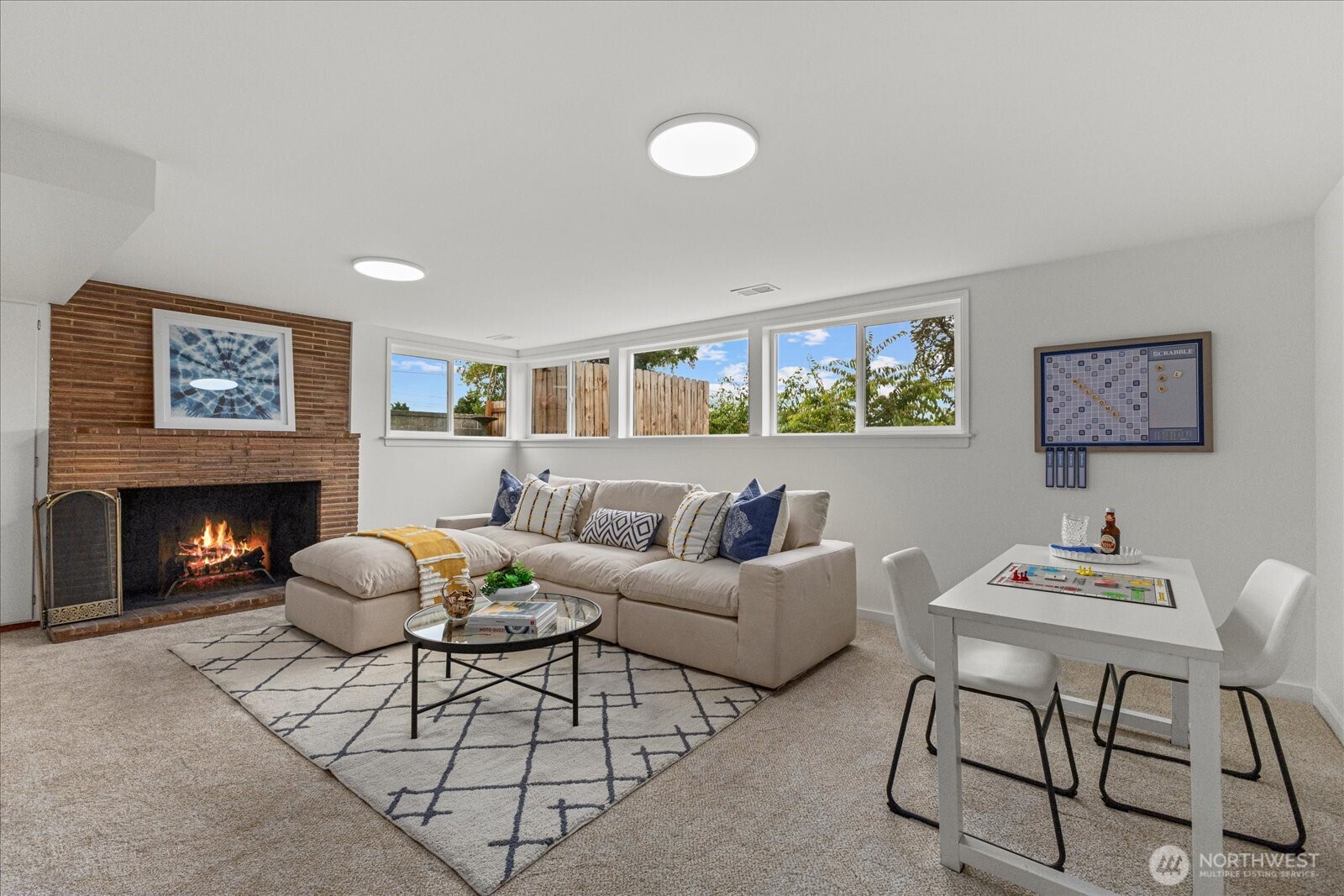 2819 West McGraw Street Seattle, WA 98199 - Photo 26 of 40 a living room with furniture a fireplace and a large window