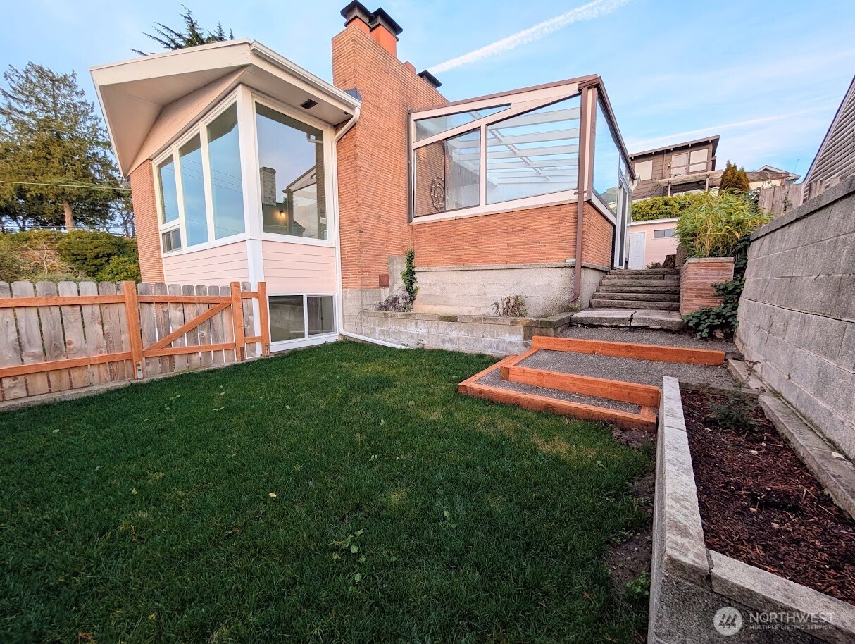 2819 West McGraw Street Seattle, WA 98199 - Photo 34 of 40 a front view of a house with a yard