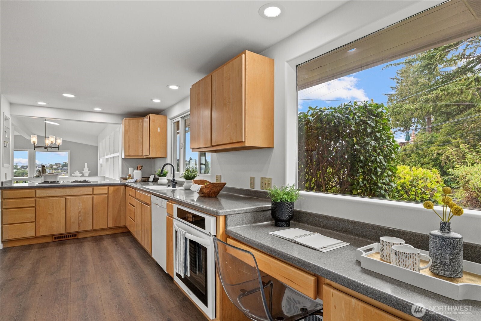 2819 West McGraw Street Seattle, WA 98199 - Photo 5 of 40 a kitchen with a sink stove and cabinets