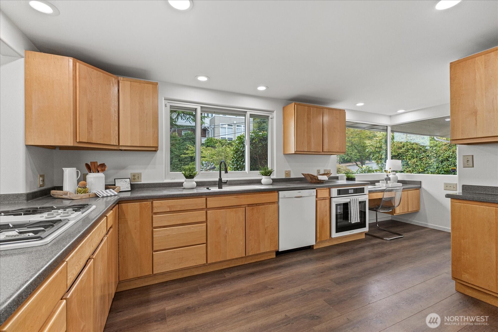 2819 West McGraw Street Seattle, WA 98199 - Photo 6 of 40 a kitchen with stainless steel appliances stove top oven and sink