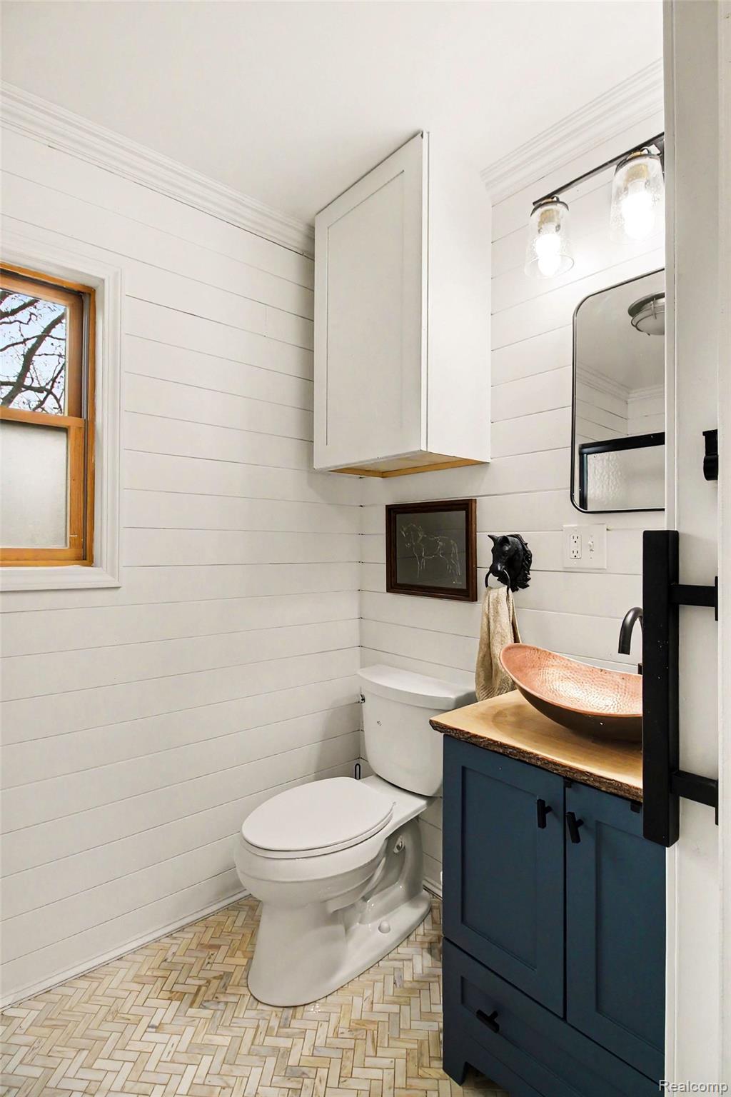 4375 Skinner Lake Road Lapeer, MI 48446 - Photo 22 of 30 Bathroom with vanity and wooden walls