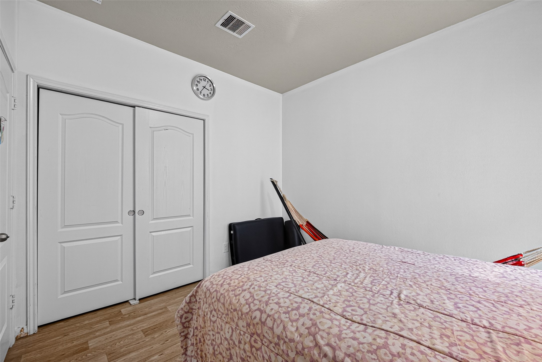 9314 Fuqua Ridge Lane Houston, TX 77075 - Photo 18 of 24 a bedroom with a bed and wooden floor