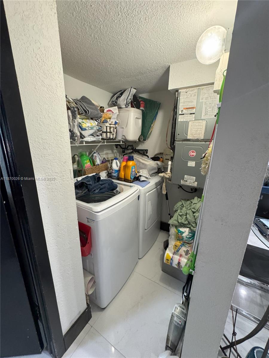 6411 West 27th Way, Unit 201 Hialeah, FL 33016 - Photo 16 of 21 a utility room with dryer and washer