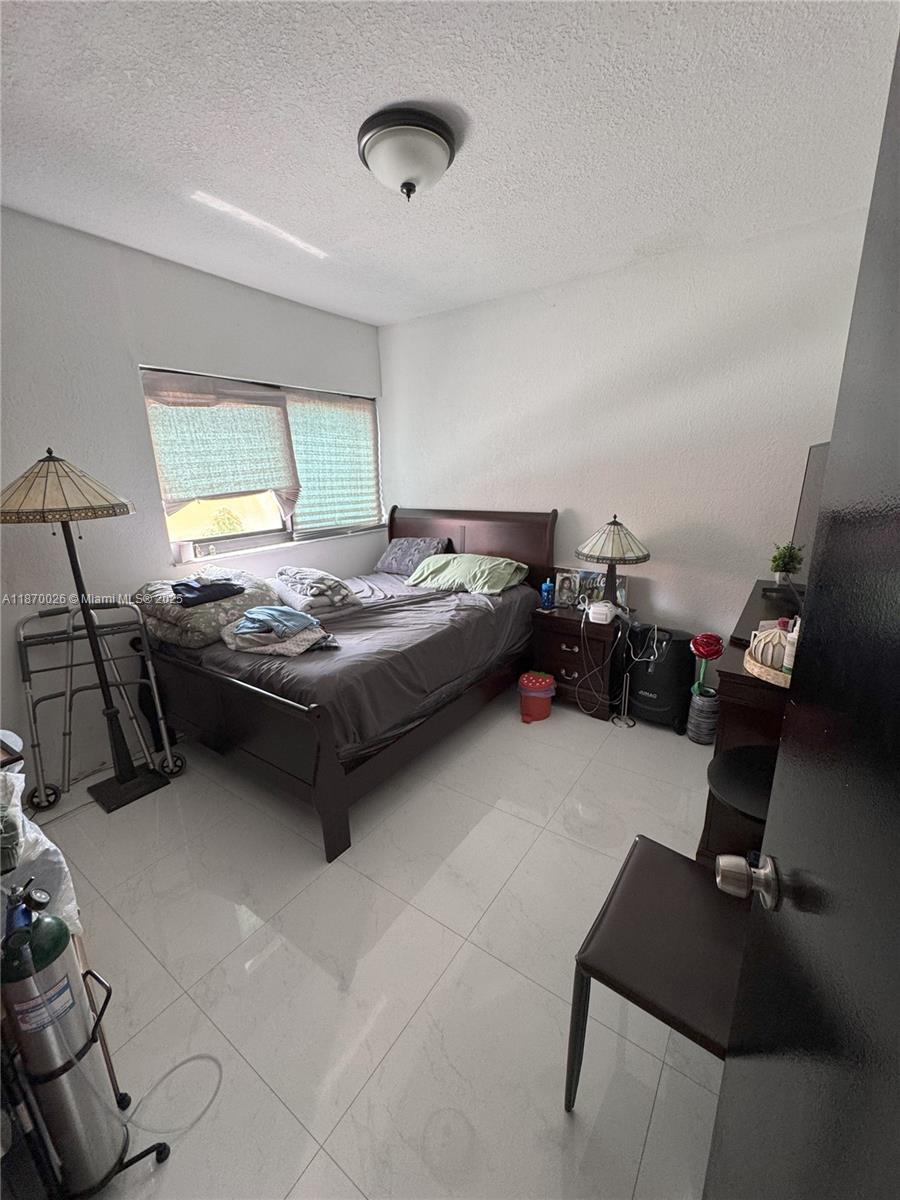 6411 West 27th Way, Unit 201 Hialeah, FL 33016 - Photo 17 of 21 a reading room with furniture and window