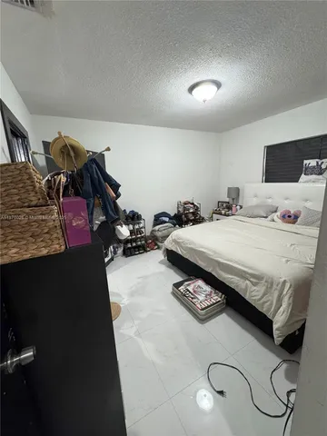 a bedroom with a bed and a closet