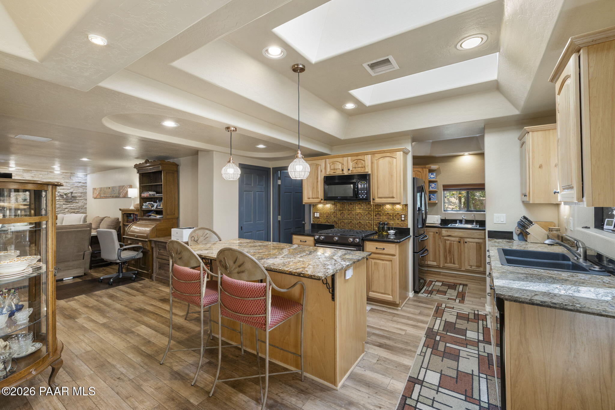 535 Copper Basin Road Prescott, AZ 86303 - Photo 13 of 41 a large kitchen with stainless steel appliances lots of counter space and furniture