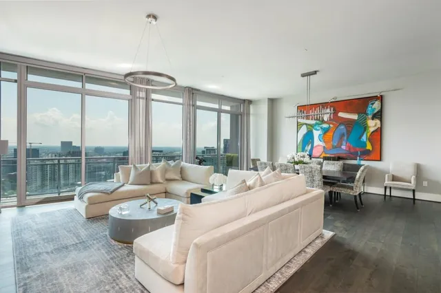 a view of a dining room with furniture and a livingroom