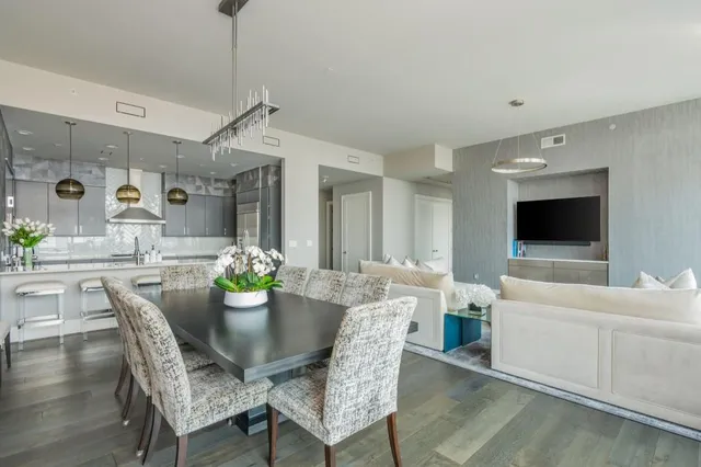 a kitchen with stainless steel appliances granite countertop a sink and a counter top space
