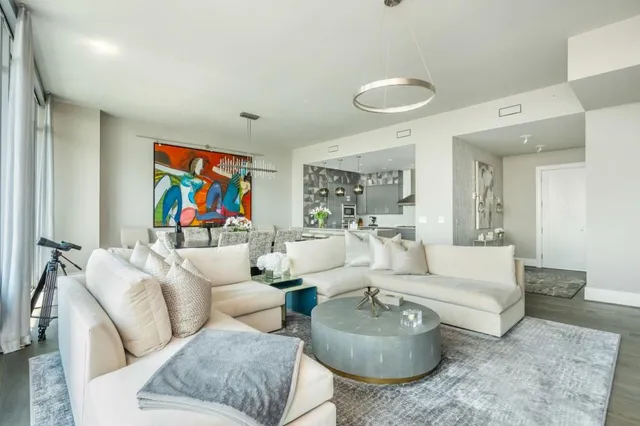 a kitchen with stainless steel appliances granite countertop a sink and a refrigerator