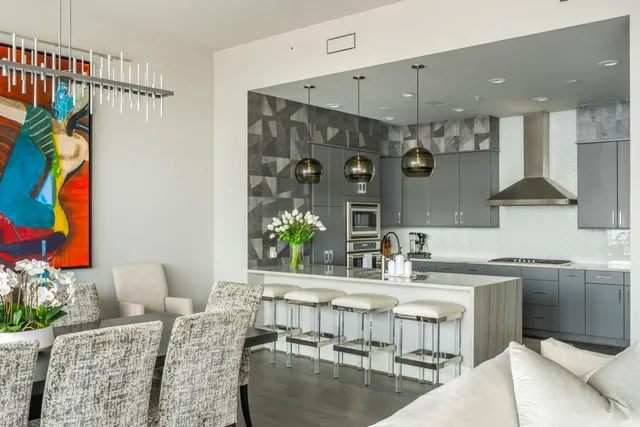 a dining room with furniture and wooden floor
