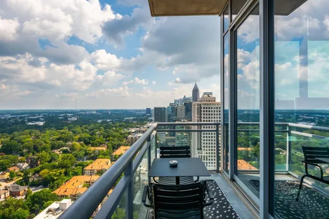 a bedroom with a bed and painting on the wall