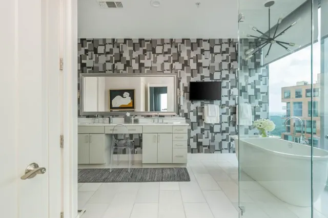 a bathroom with a sink toilet and shower