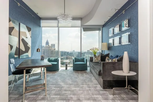 a green field with trees in front of it