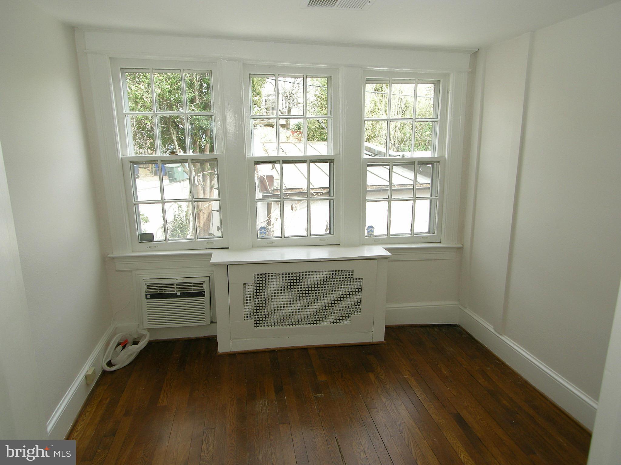 2815 Woodley Road Northwest Washington, DC 20008 - Photo 17 of 25 a room with a window and wooden floor