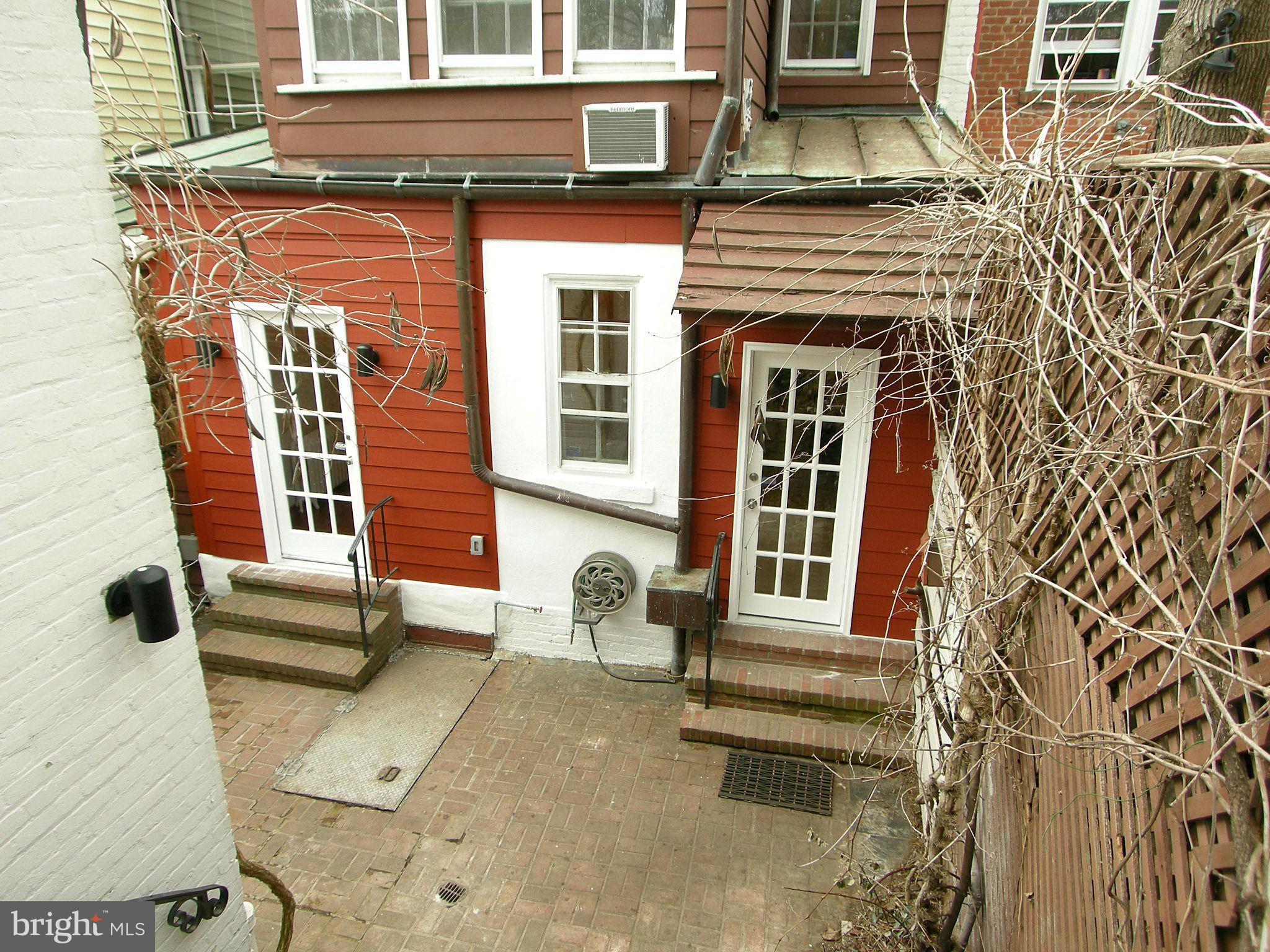 2815 Woodley Road Northwest Washington, DC 20008 - Photo 10 of 25 a front view of a house with a yard