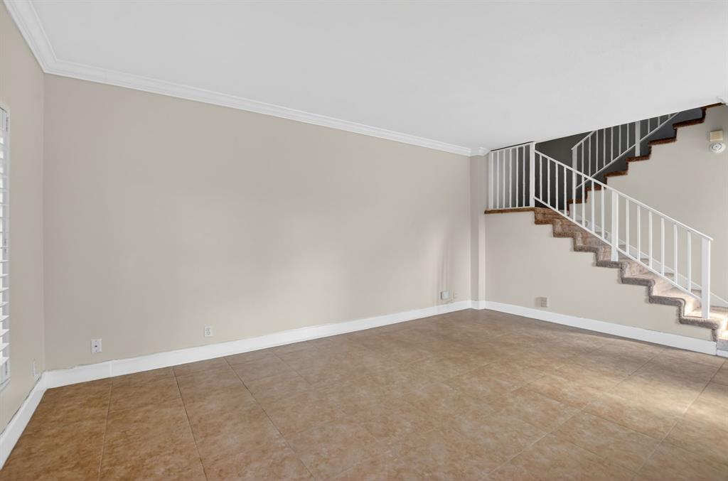 596 Southeast 20th Avenue, Unit 4 Deerfield Beach, FL 33441 - Photo 11 of 51 a view of an empty room with stairs