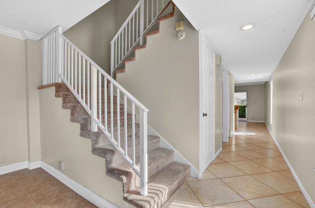 596 Southeast 20th Avenue, Unit 4 Deerfield Beach, FL 33441 - Photo 13 of 51 a view of entryway and hall with wooden floor